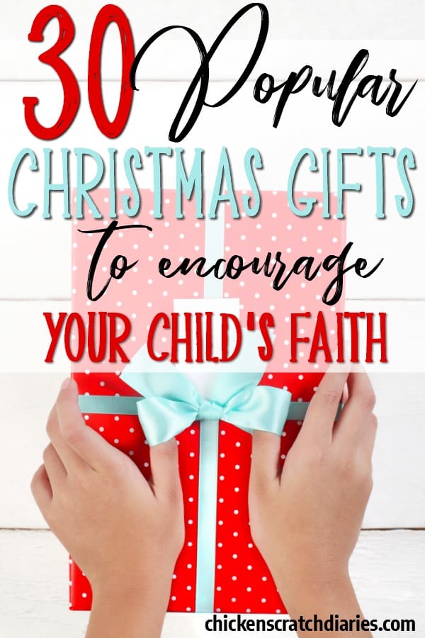 A child's hands holding a gift box with text overlay "30 popular Christmas gifts to encourage your child's faith"