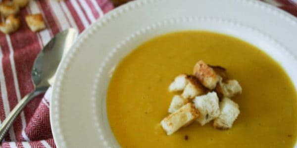 Bowl of squash soup with croutons.