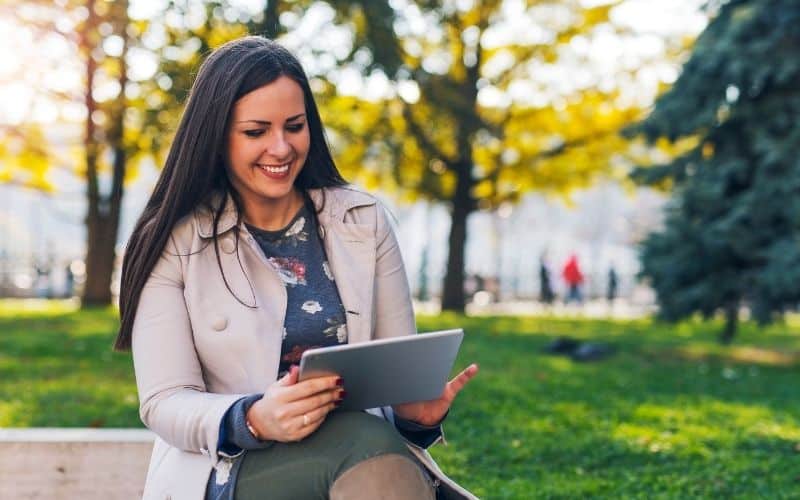 woman earning income online using tablet