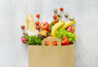 Image of a bag of groceries. Links to article on meal planning below.