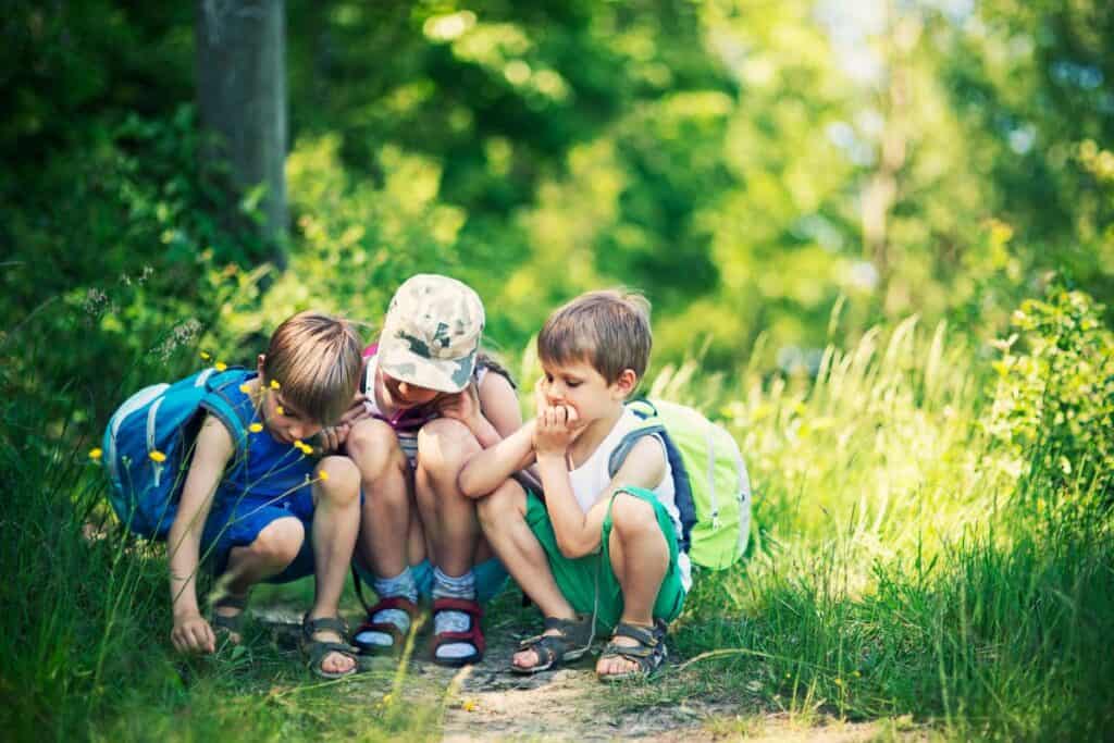 kids exploring outside together.