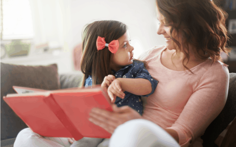 How to not be an overindulgent parent: image of mom reading with daughter