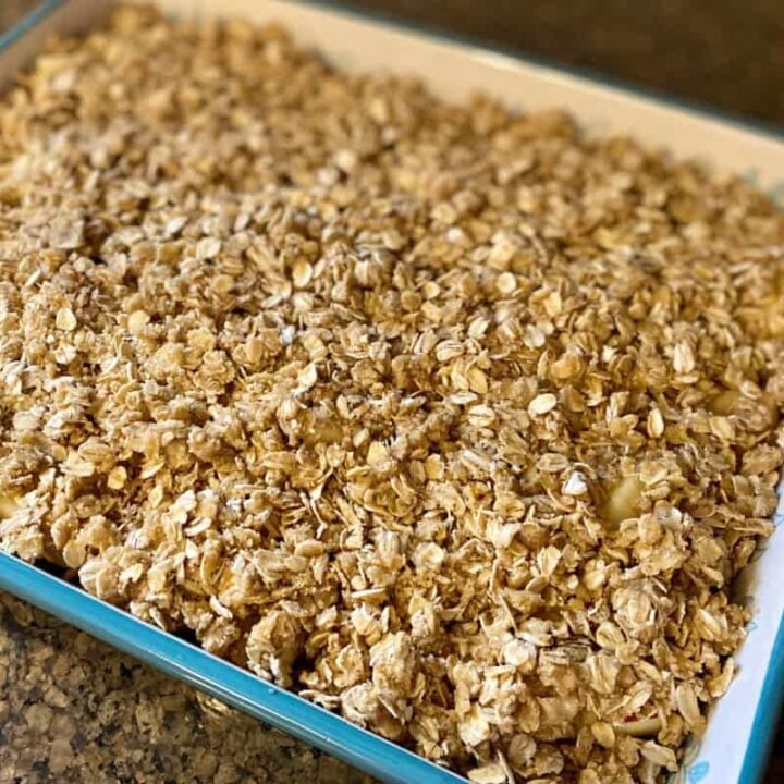 Finished apple crisp recipe in large stoneware baker.