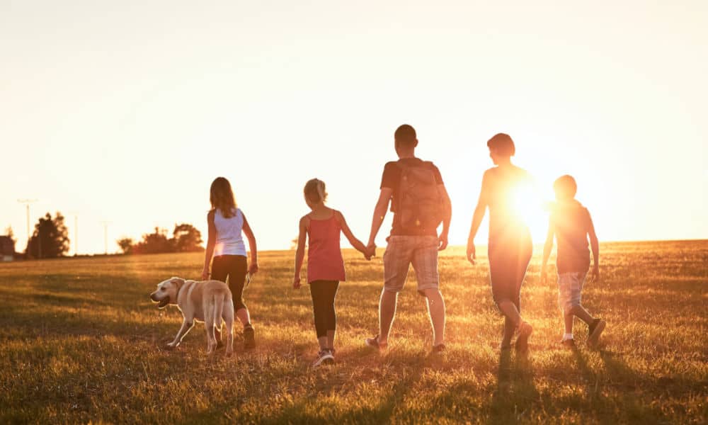 Trusting God with our Children (image of family walking outdoors)