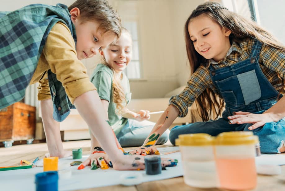 Kids painting together.