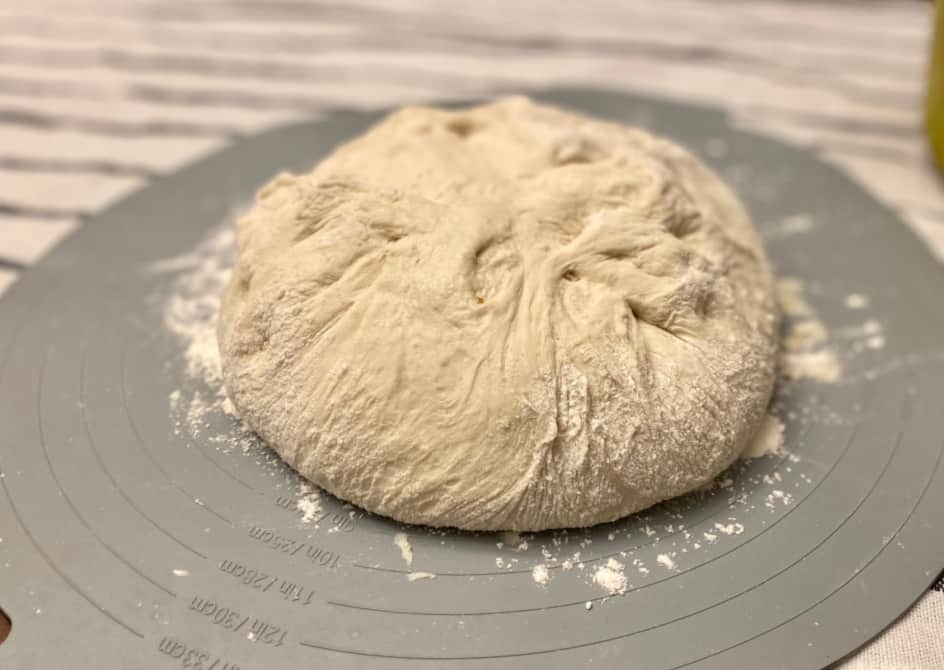 french bread dough on a dough mat.