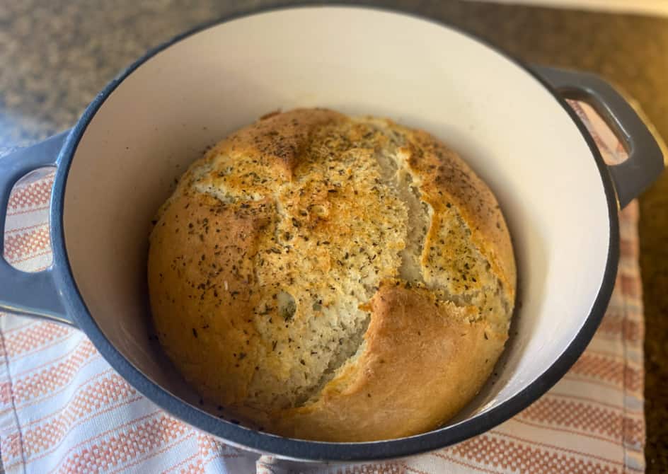 finished rustic french bread loaf in dutch oven.