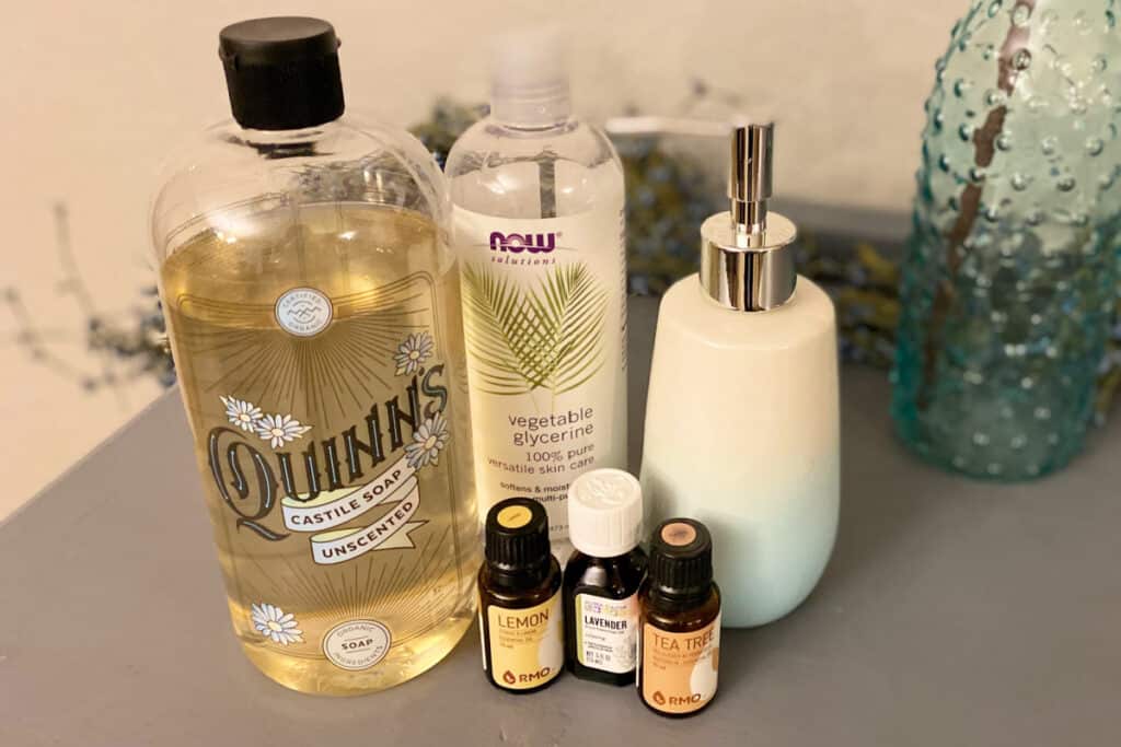 Ingredients for face wash displayed on a grey table.