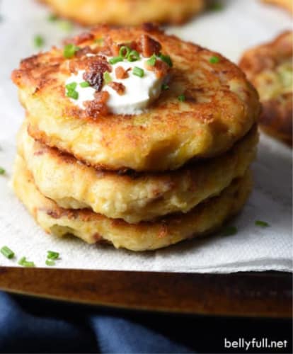 cheap lunch idea for kids: loaded mashed potato cakes stacked on a plate