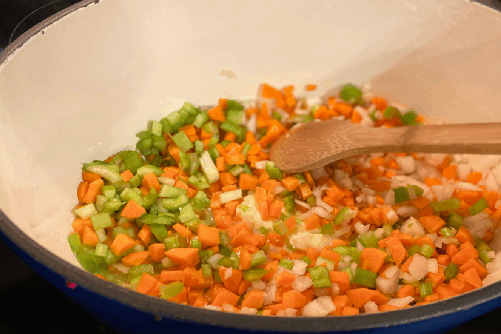 Diced celery, carrots and onions sauteed in a Dutch oven.