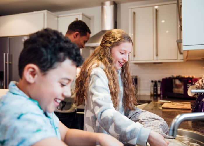 Kids doing dishes and helping out-taking responsibility around the house.