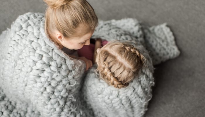 Be respectful- how to teach this concept to kids; example of mom sitting down wrapped in a blanket with young daughter, having a conversation.