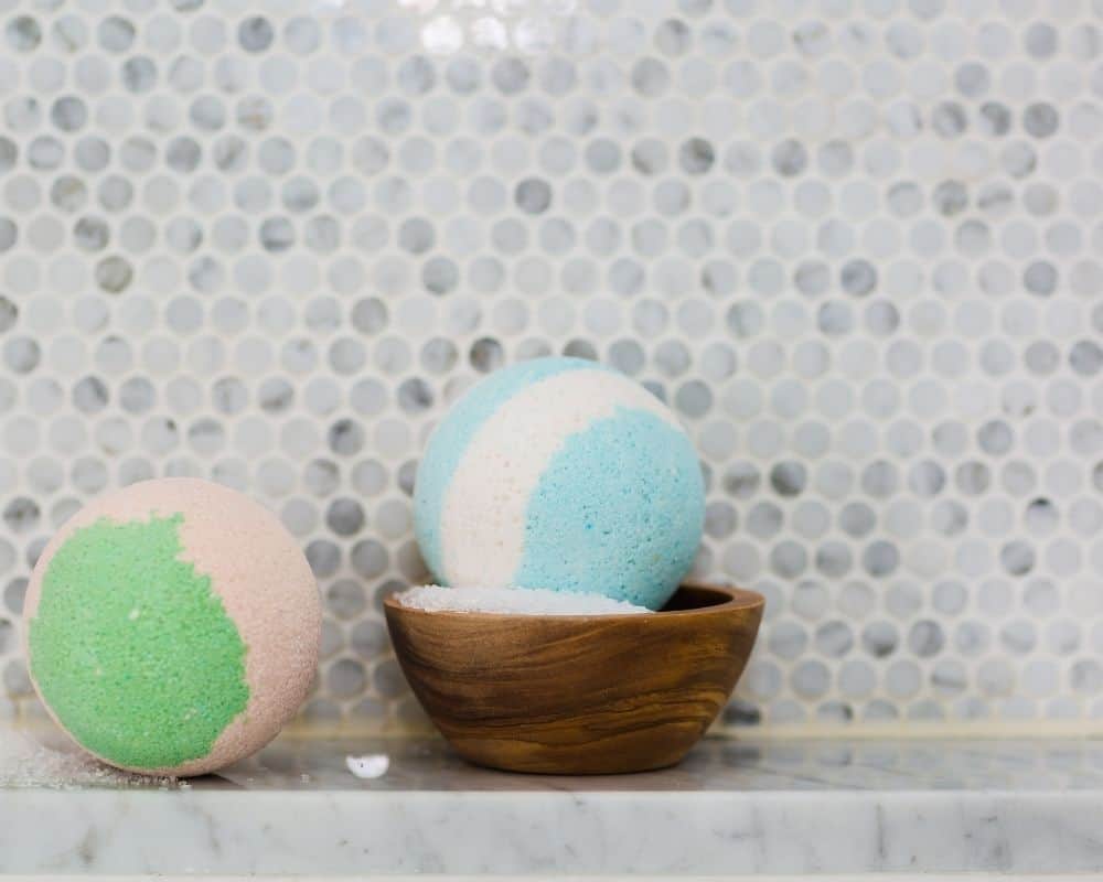 Image of colored bath bombs sitting on a bathroom shelf. Concept of a fun DIY craft for kids.