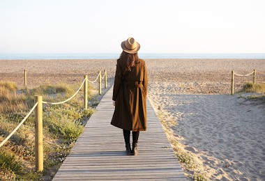 woman walking on a pier-experiencing God's faithfulness concept