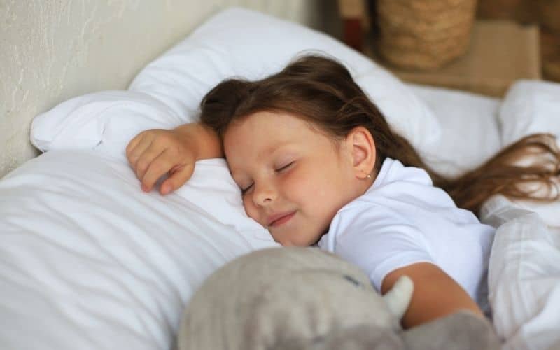 image of child sleeping late in summer time