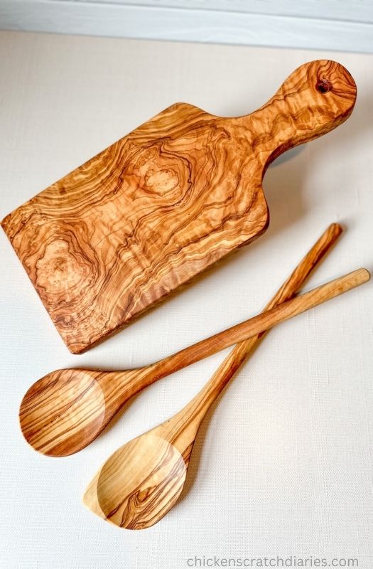 Wooden cutting board and 2 wooden spoons from Forest Decor.