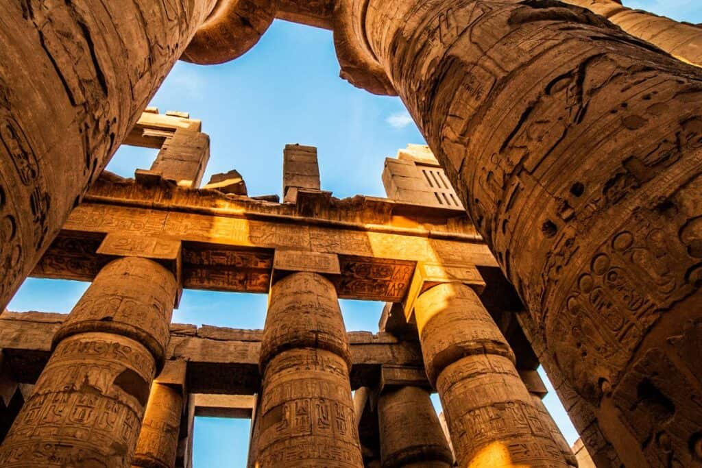 Ruins from ancient Egypt against a blue sky.