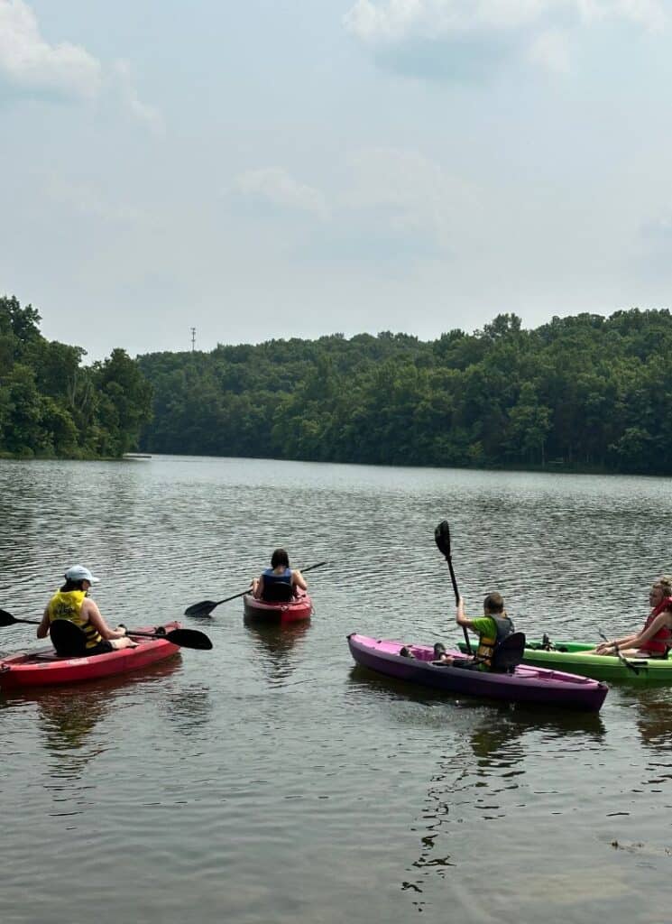 Family kayaking at Lake Corinth, Kentucky.