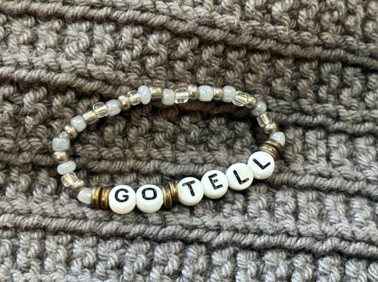 Image of finished bracelet on a grey textured background.