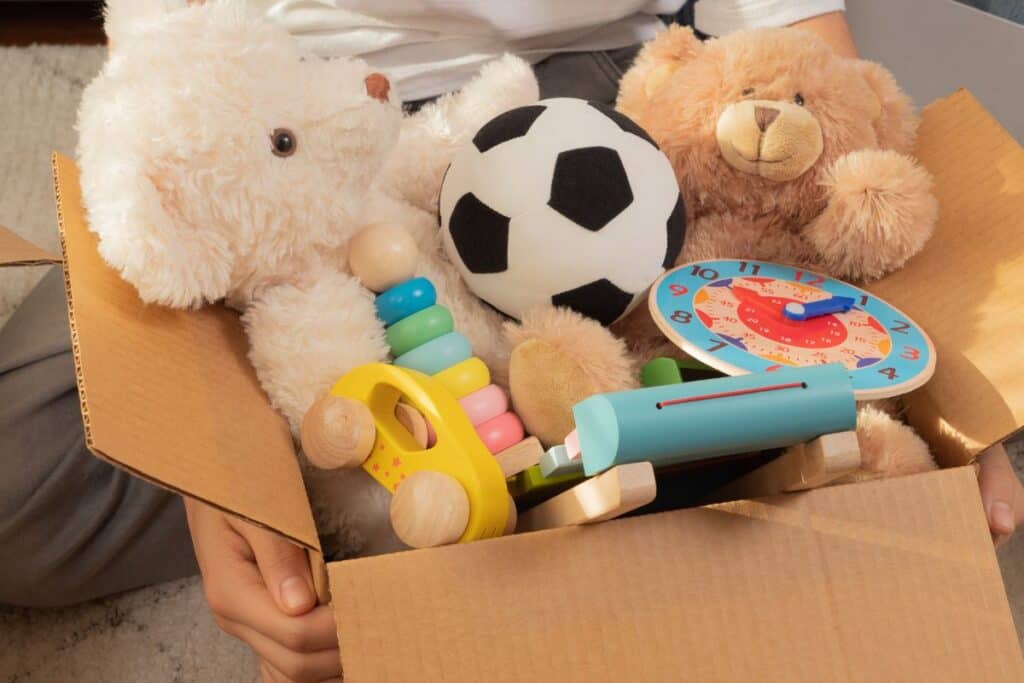 Cardboard box of toys ready to donate.