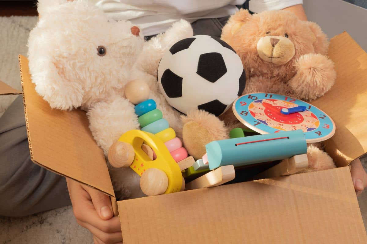 Cardboard box of toys ready to donate.
