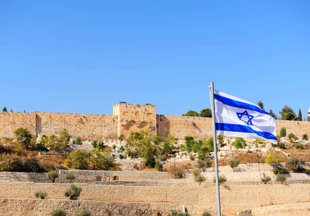 View of Old City of Jerusalem with Israeli flag
