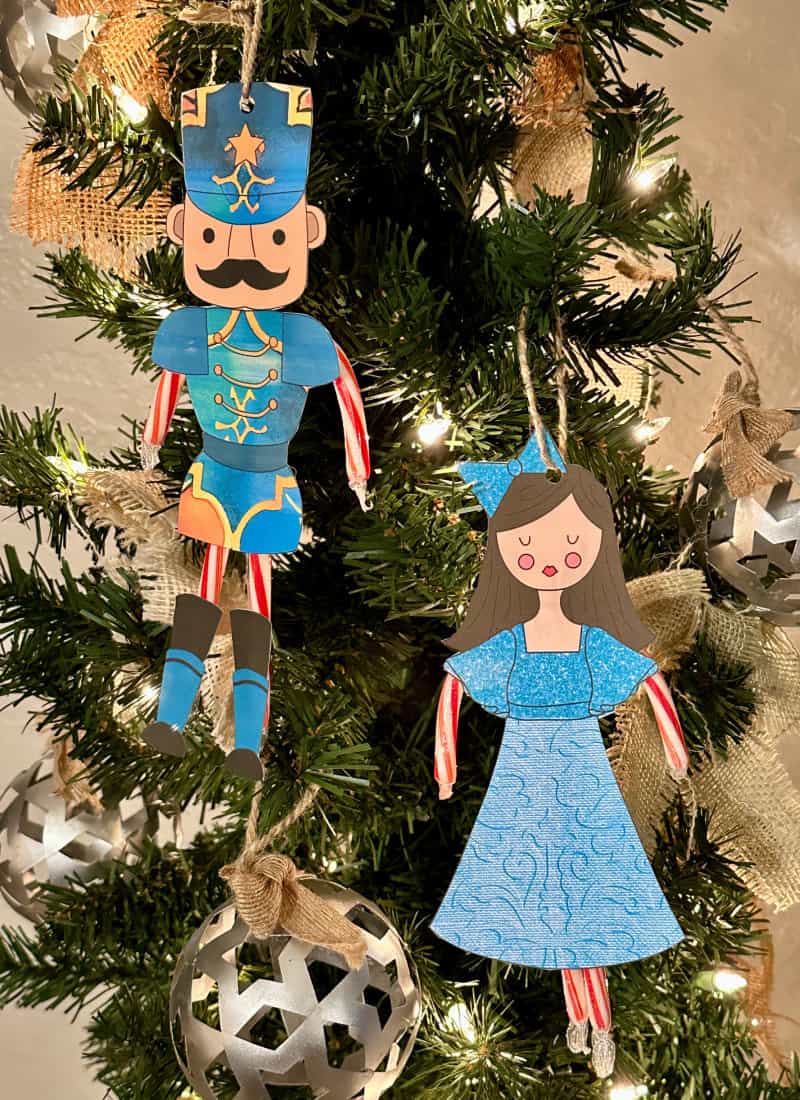 Nutcracker and Clare ornaments hanging on tree
