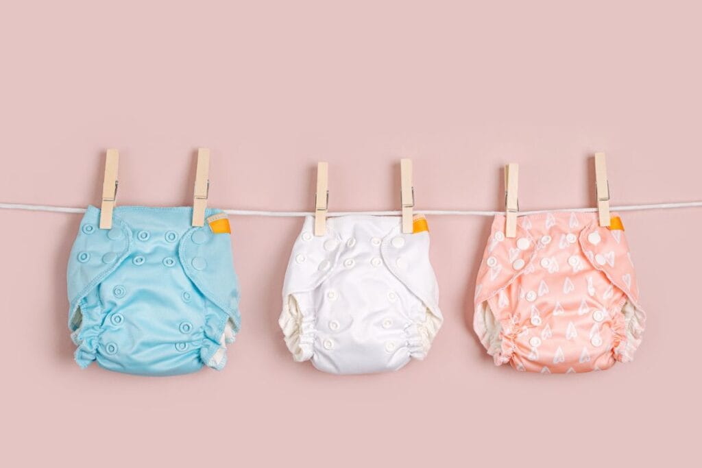 Three cloth diapers on a clothesline