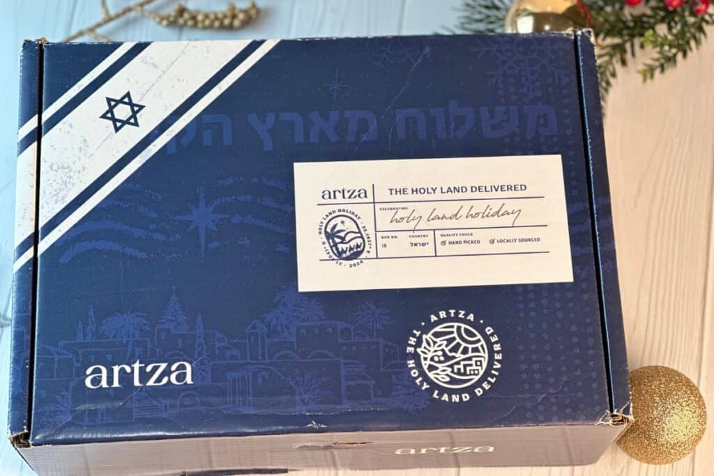 Outside of unopened Artza Christmas box on holiday background.