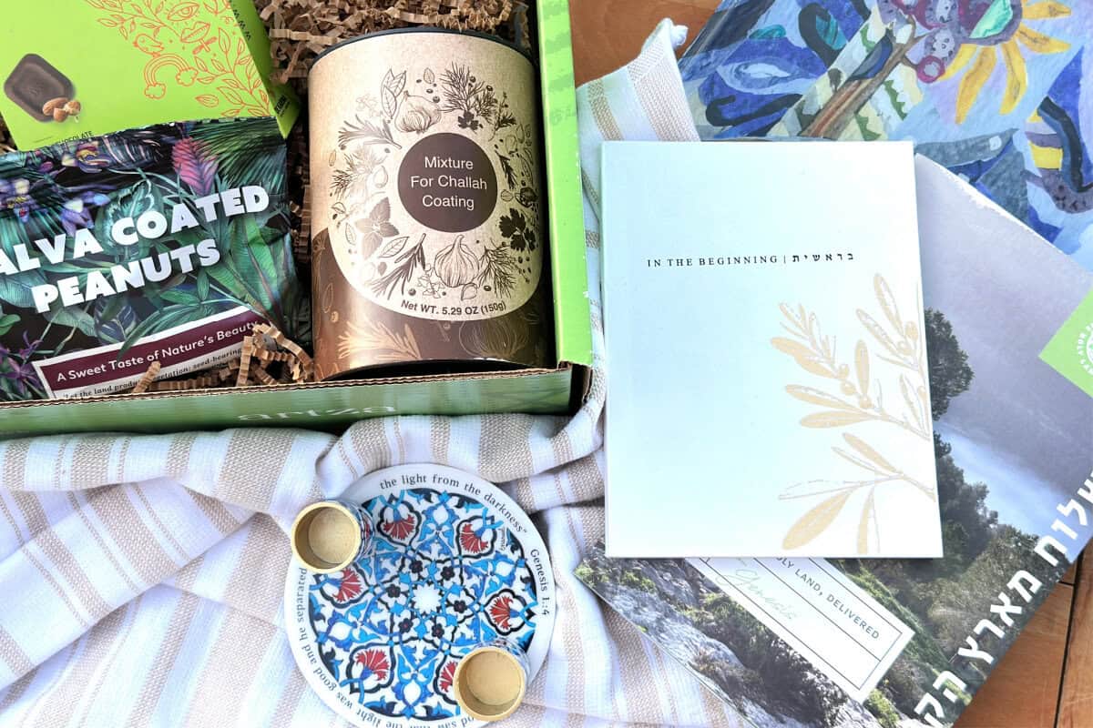 Featured photo with box items displayed with striped tea towel on wooden surface