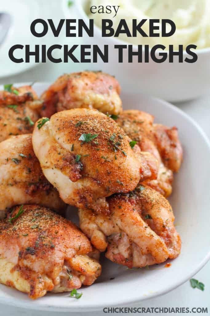 vertical image of chicken thighs on white plate with text overlay "Easy Oven Baked Chicken Thighs"