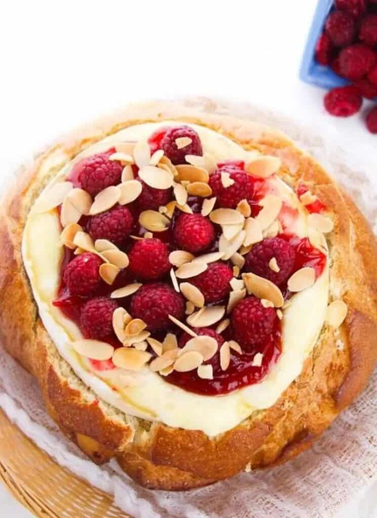 Sourdough boule with brie and raspberries and almonds.