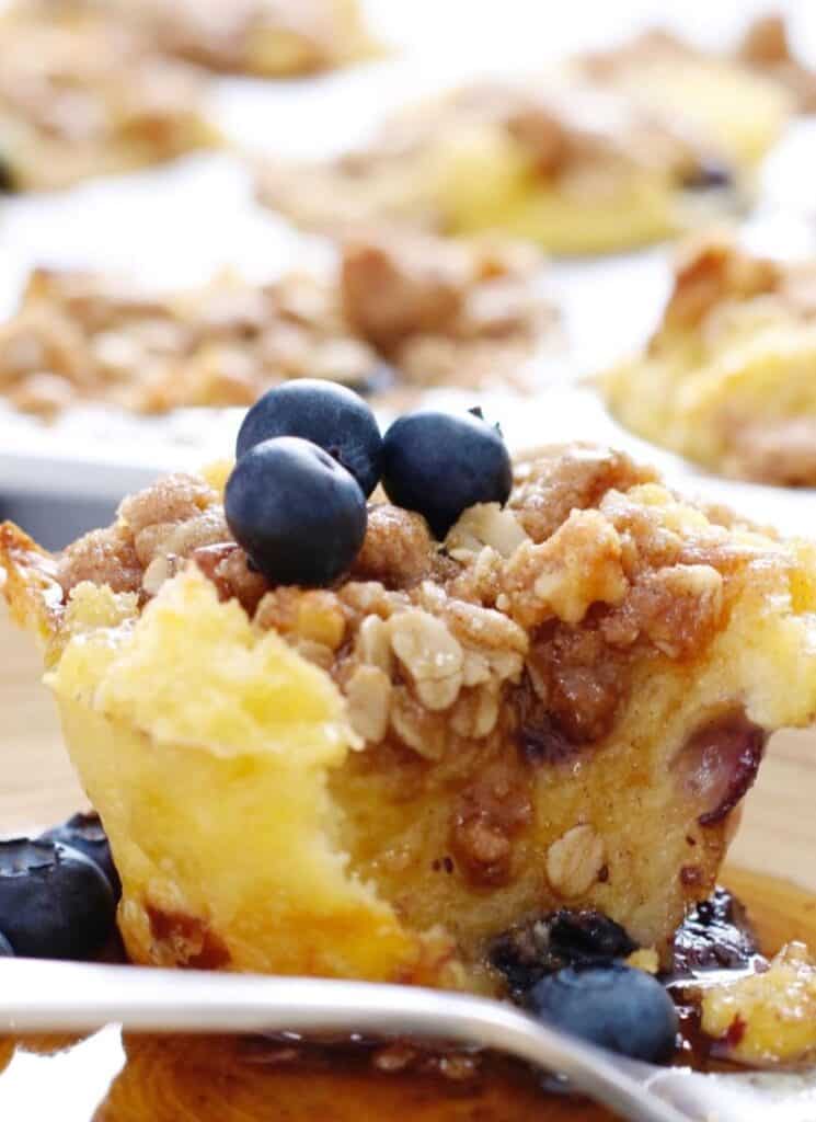 Moist french toast muffin topped with blueberries.