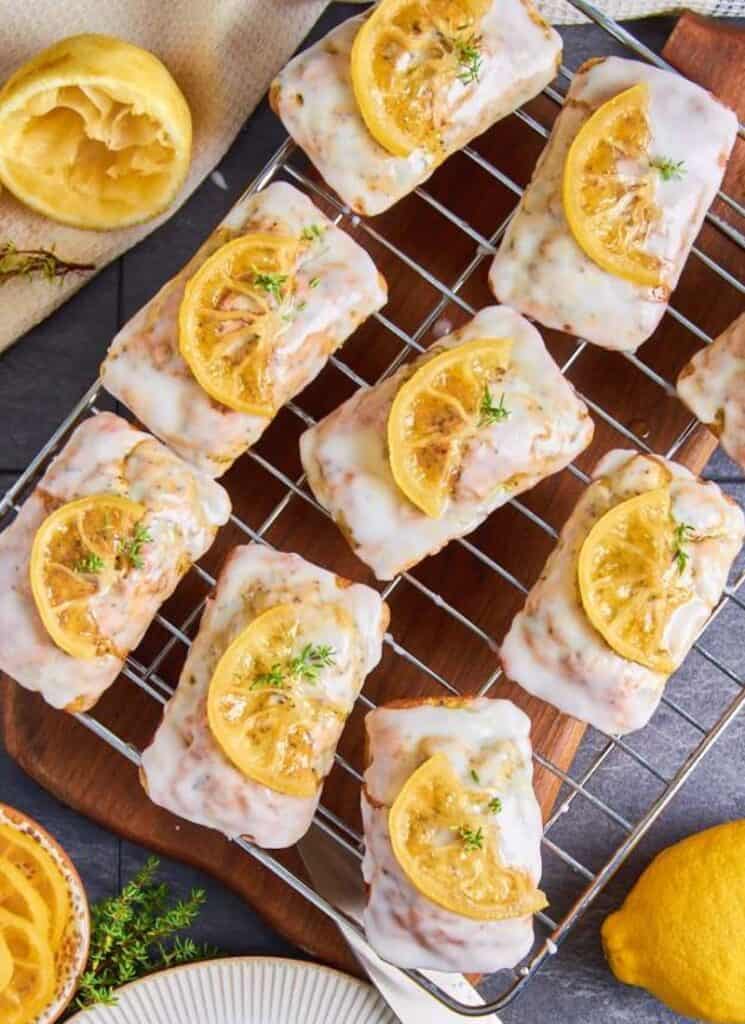 Mini loaves with glaze and lemon slices on top.