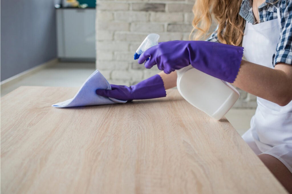 Woman cleaning a kitchen.