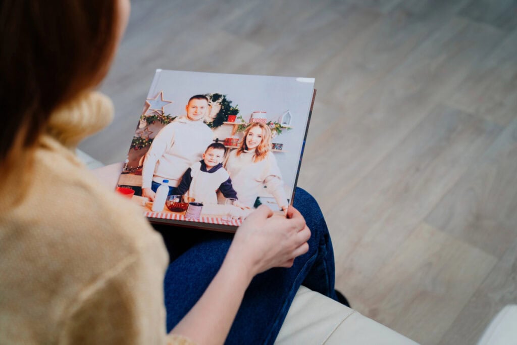 Woman looking at a photobook