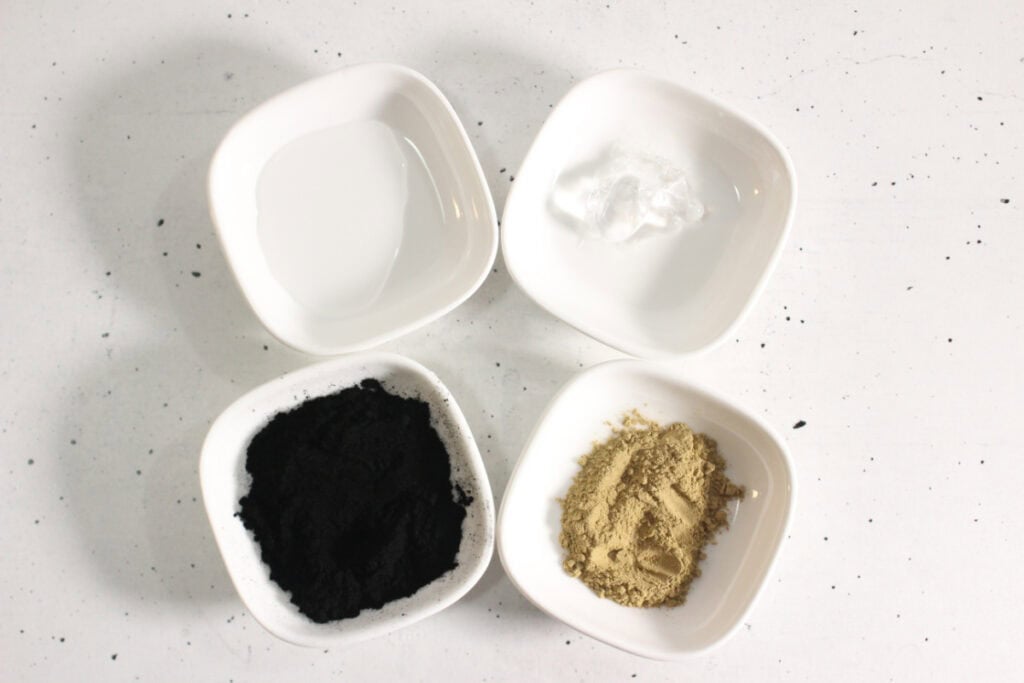 Four white bowls with mascara ingredients.