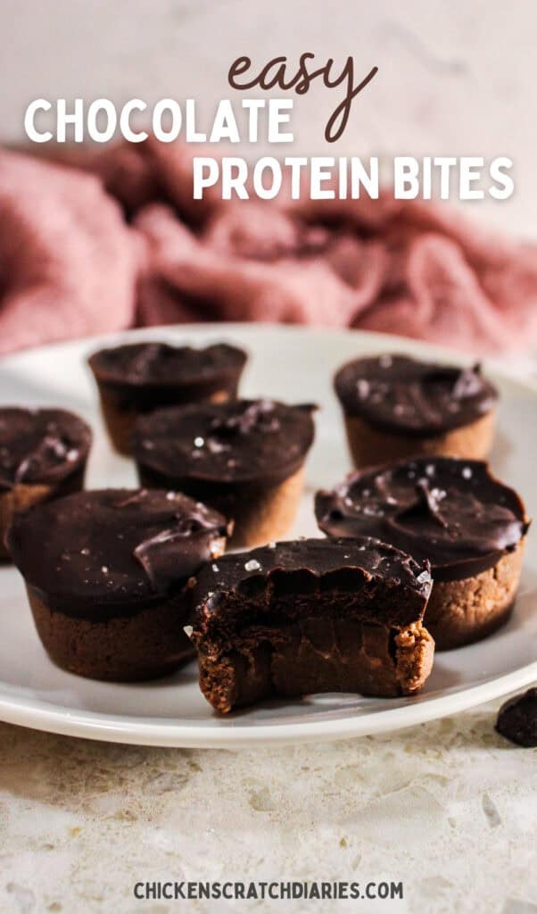 Vertical image of protein bites on a plate with bite taken out of one, and text overlay "easy chocolate protein bites"