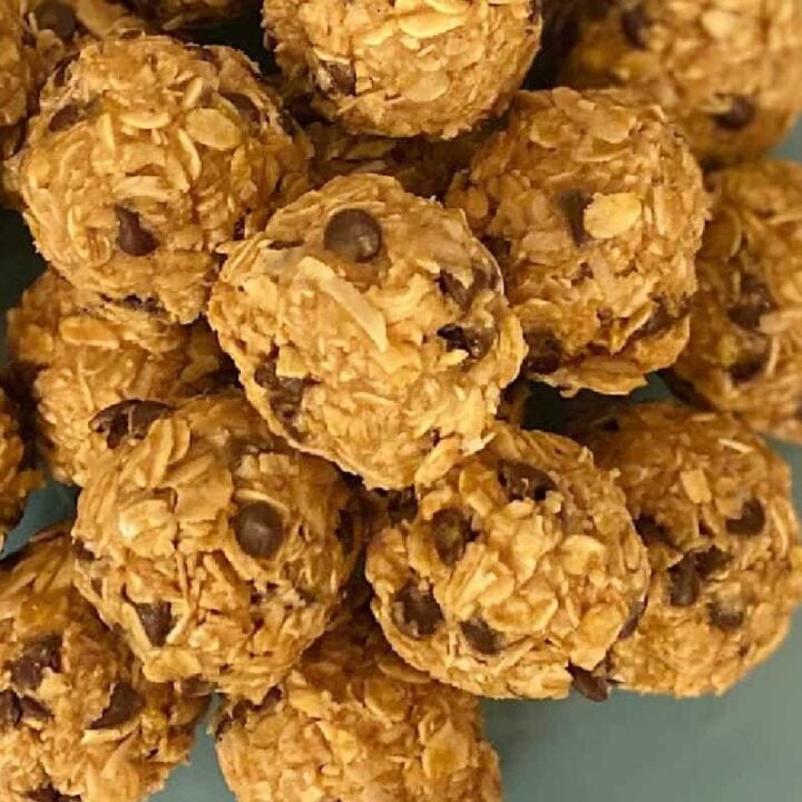 Closeup of peanut butter protein bites on blue platter