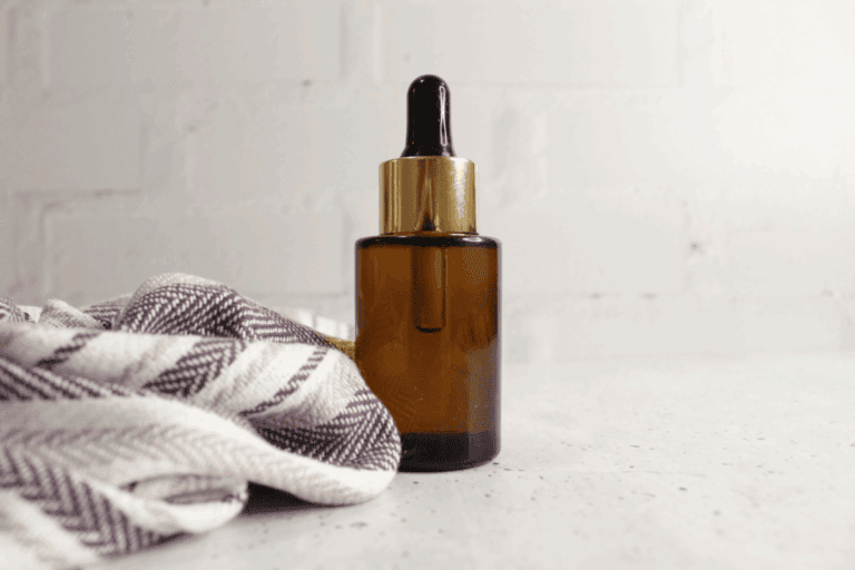 Glass bottle of makeup remover on countertop
